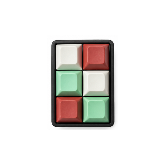 The Fidgeter 6-key rectangle fidget with mint green, white, and terracotta keycaps on a black base.