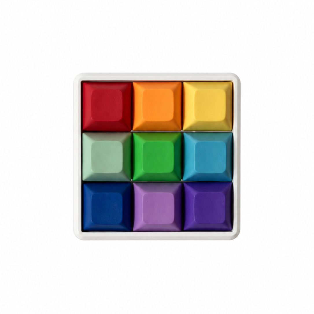 The Original 9-key square fidget with rainbow-colored keycaps on a white base.