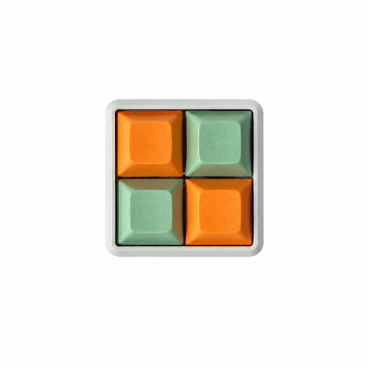 The Pocket 4-key square fidget with orange and mint green keycaps on a white base.