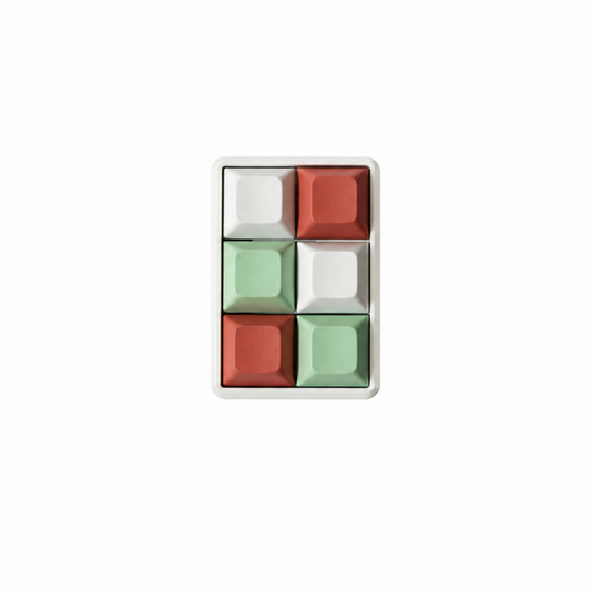 The Fidgeter 6-key rectangle fidget with mint green, white, and terracotta keycaps on a white base.
