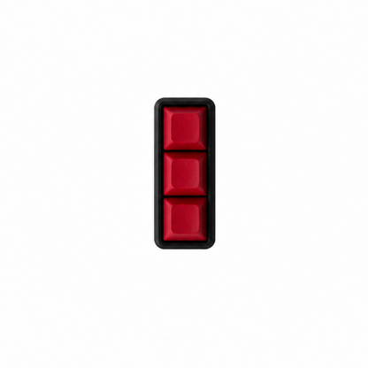 The Mini 3-key fidget with solid red keycaps and a black base.