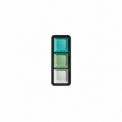 The Mini 3-key fidget in Sea Breeze, with cyan, light green, and white keycaps and a black base.