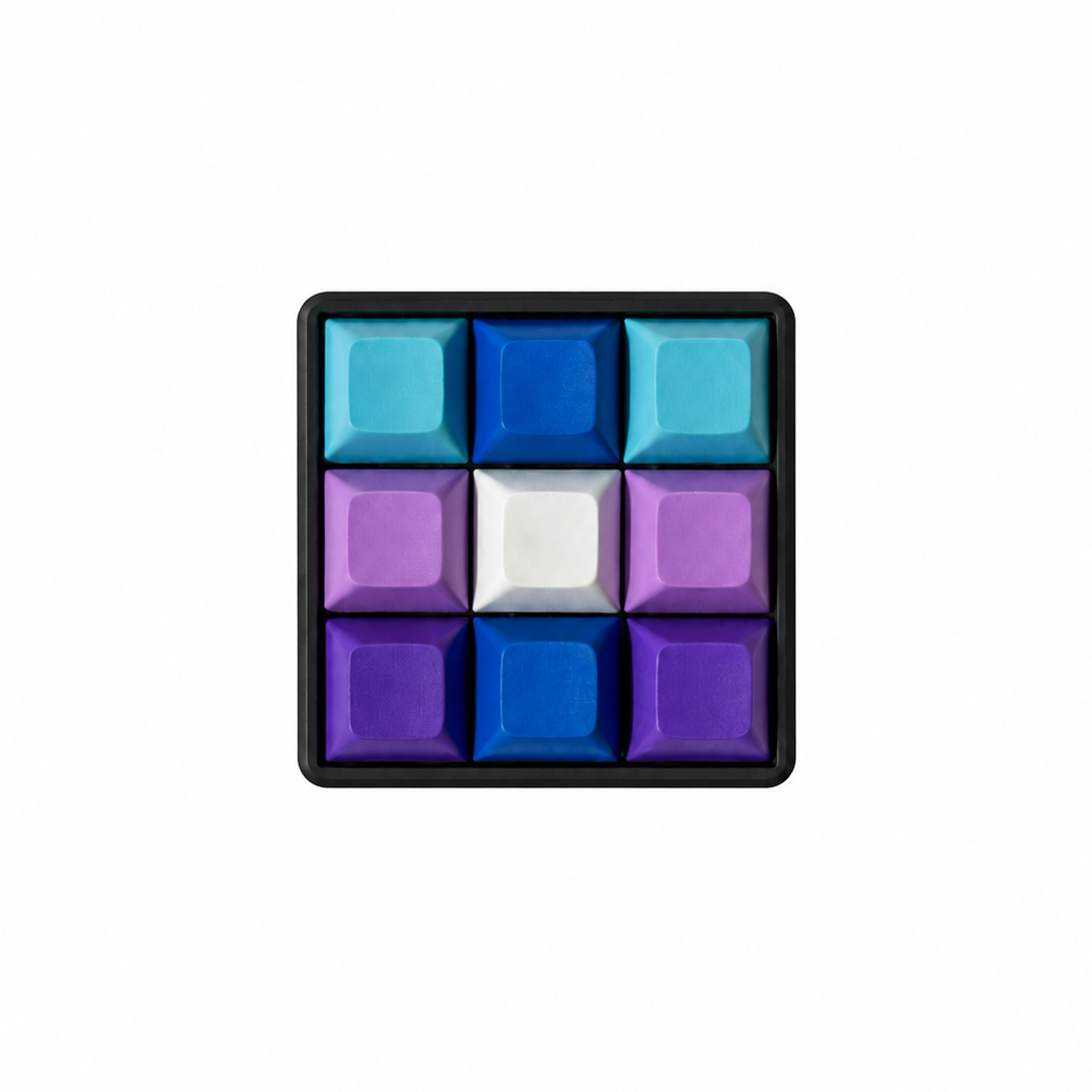 The Original 9-key square keyboard fidget in Blueberry Swirl with a black base.