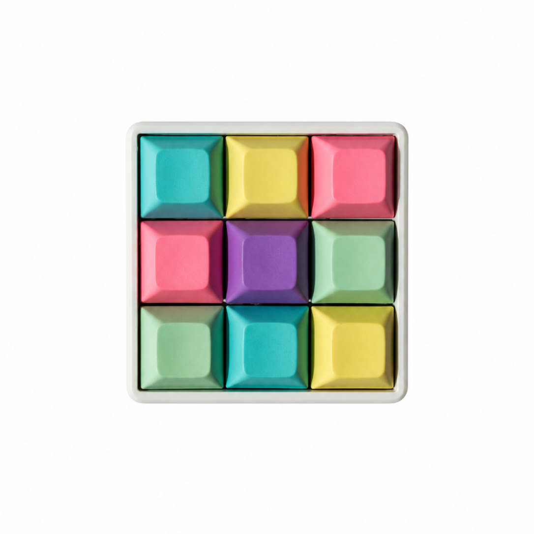The Original 9-key square fidget with cyan, yellow, pink, lavender, and mint green keycaps on a white base.