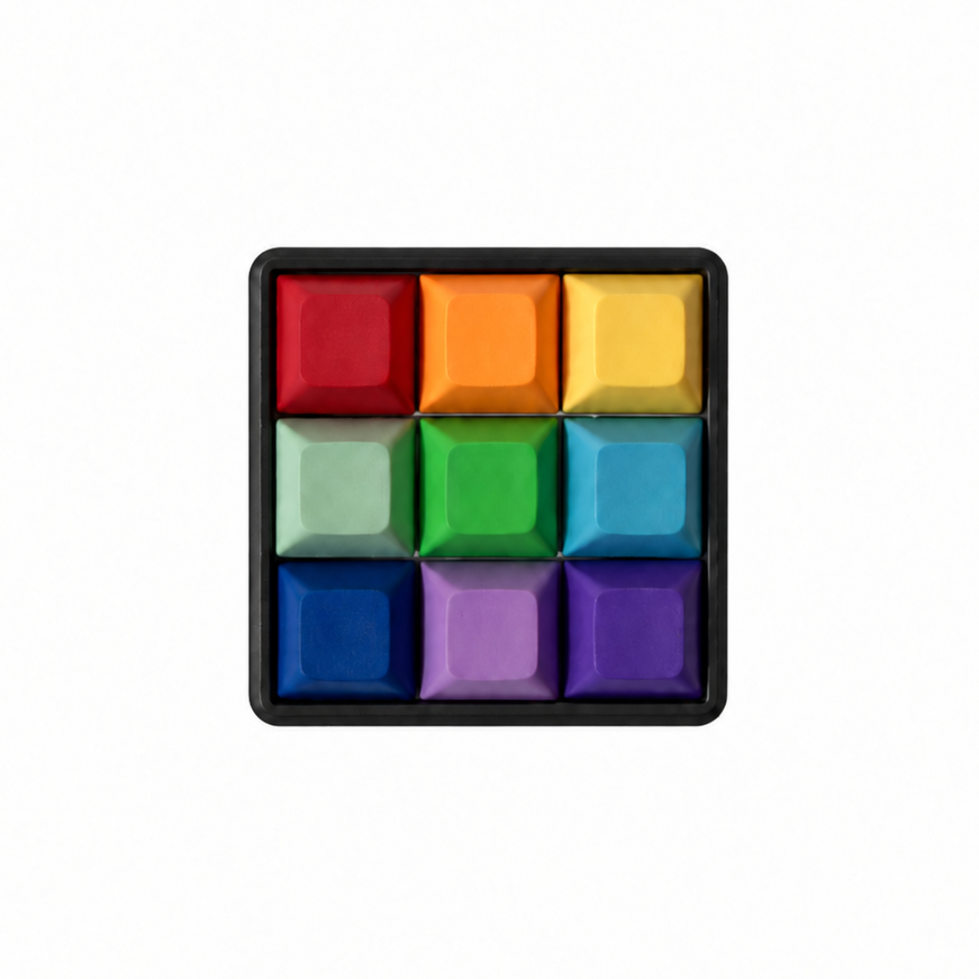 The Original 9-key square fidget with rainbow-colored keycaps on a black base.