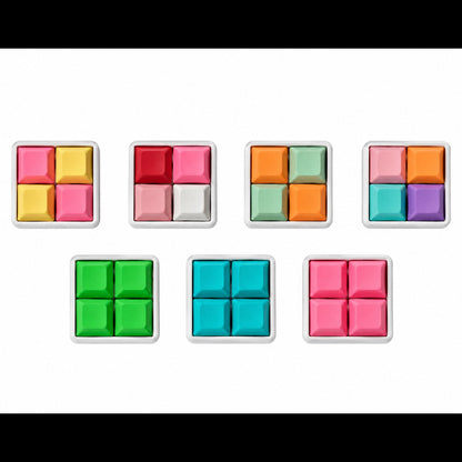 Top view of seven Pocket 4-key square keyboard fidgets with white bases in different keycap color combinations.
