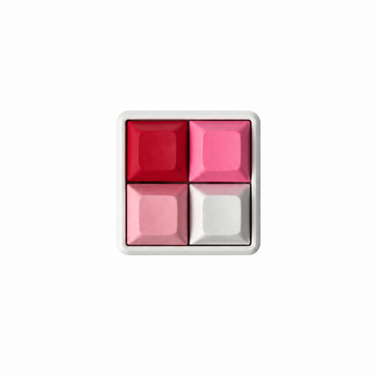 The Pocket 4-key square fidget with red, rose red, pink, and white keycaps on a white base.