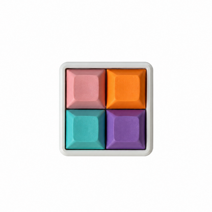 The Pocket 4-key square fidget with pink, orange, blue, and purple keycaps on a white base.